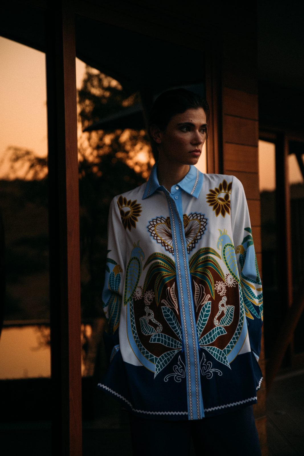 Big print shirt against the tent
